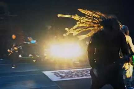 Brian Welch thrashing hair on stage at concert