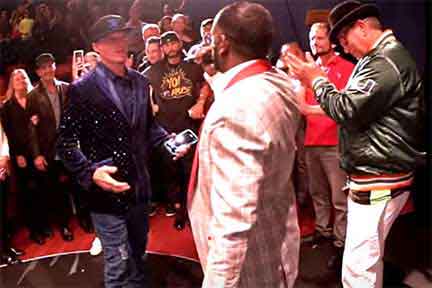 DJ Earthquake speaking to Vanilla Ice on red carpet